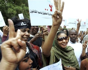 Sudanese journalist Lubna Hussein, right, who faces 40 lashes on the charge of 