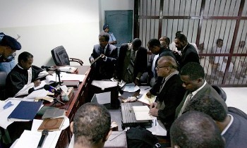 A picture taken on September 11, 2008 shows Sudanese Islamists (back R) accused of killing a US diplomat and his driver attending their trial in Khartoum (AFP)