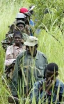 LRA troops march towards an the assembly point in Owiny Ki Bul, 160km (100 miles) south of Juba, Sudan September 20, 2006 (Reuters)