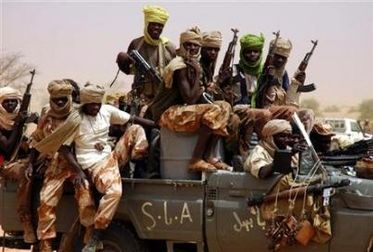 Members of the Sudan Liberation Army disembark from their vehicle in Susuwa, north Darfur, May 15, 2006. (Reuters)
