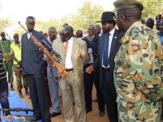 GOSS Interior Minister Lt Gen. Gier Chuang is looking at a brand new weapon with a telescope during the inspection of collected illegal arms by South Sudan President  Salva Kiir in Juba on Saturday 11, 2009 (photo Larco Lomayat)