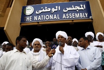 Sudan's parliament speaker Ahmed Ibrahim Al-Tahir (center) - Reuters