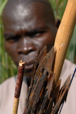 Arrow boy from WES displays some of weapons used against LRA rebels (photo Tim Makulka -UN)