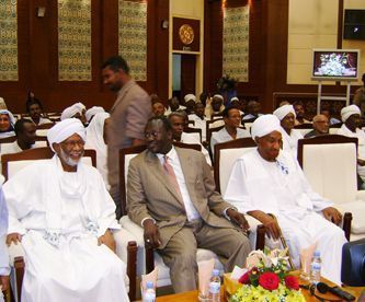 from the left, Hassan Al Turabi, Riek Macghar and Sadiq Al-Mahdi at the signing of Juba declaration in Khartoum on Oct. 14, 2009 (Al-Jazeera)