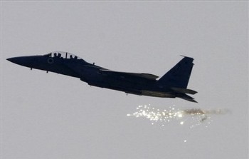 An Israeli fighter plane  releases a flare (AP)