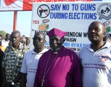 Bor Commissioner Maker Lual Kuol (L), Deputy Gov. Hussein Mar Nyuot (2nd L), Bishop Nathaniel Garang Anyieth and anti-Small arm officer pose for a photo after Sunday open ground prayer in Bor Town on Decemeber 6, 2009 (photo by Philip Thon Aleu -- ST)