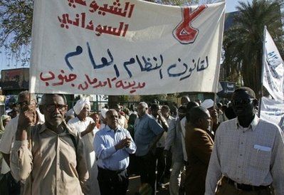 Sudanese opposition supporters hold a banner against the government's electoral laws in Khartoum. (AFP)