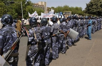 File photo showing Sudanese riot police line up closing the road leading to the offices of the EU commission (AP)