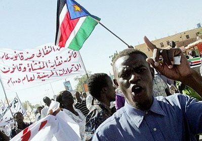 A Sudanese opposition supporter shouts slogans as protesters wave the flag of Sudan People's Liberation Movement (SPLM) during a demonstration against the government in Khartoum. (AFP)