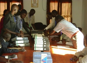 SPLM Electoral College officers organize files containing