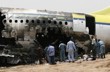 FILE - Rescue teams work at the scene of a Sudan Airways accident at Khartoum airport on June 11, 2008 (Getty Images)