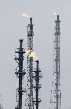 A flame burning natural gas is seen at an oil refinery (Reuters)