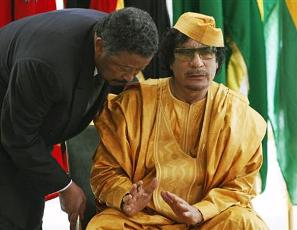 African Union Commission Chairperson Jean Ping (L) talks with Libyan leader Moammar Gadhafi ahead of 13th AU summit in Sirte, Libya (AP)