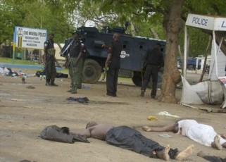 FILE - Bodies lay in the streets near an armoured vehicle in Maiduguri after religious clashes in Nothern Nigeria, July 31, 2009 (Reuters)