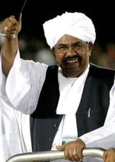 Sudanese President Omar al-Beshir arrives to a campaign rally at Al-Hilal Stadium in Khartoum February 13, 2010 (AFP)