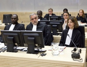 FILE - Prosecutor Luis Moreno-Ocampo (C) and his team are seated for the court appearance of Darfur rebel leader Bahr Idriss Abu Garda, at the International Criminal Court in The Hague May 18, 2009 (Reuters)