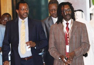 El-Tijani El-Sissi, LJM chairman (L) and Mahjoub Hussein, LJM secretary for political affairs, arrive for the signing of a framework deal with Sudanese government in Doha on March 18, 2010. (Getty)