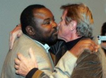 France’s foreign minister Kouchner embracing Darfur rebel leader Al-Nur in a meeting for Darfur organized by rights activists in Paris in April 2007 during the campaign of presidential election