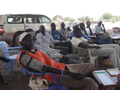 Election ink stamp staff and political party agents at a polling station in Rumbek