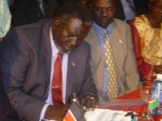 A file photo shows Malik Aggar signing a protocol of Blue Nile nad S. kordofan during the celebration of the CPA in Nairobi January 9, 2005 (ST)