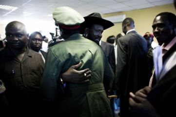 Salva Kiir, the President of the Government of South Sudan, hugs a military officer following his acceptance speech of a second presidential term in Juba, Monday, April 26, 2010. (AP)