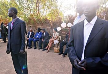 Security guards secure the area as Sudanese Vice President and South Sudan leader Salva Kiir (rear 2nd-L) speaks with international observers before voting in the southern capital of Juba on April 11, 2010. (Getty)