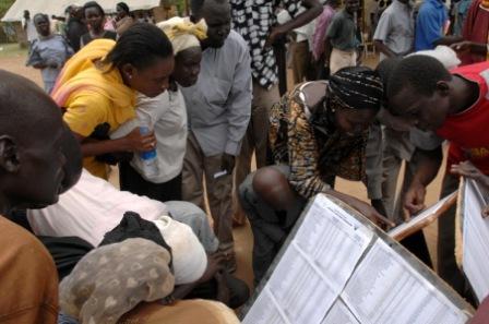 Southern Sudaneses check the registered voters list for their names, at a polling station in Juba, Southern Sudan, Sunday April 11, 2010. (UNMIS)