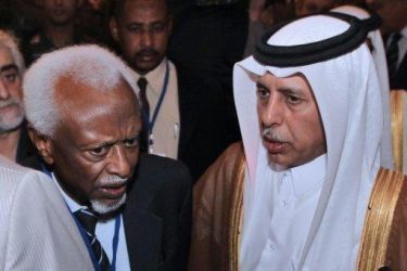 Qatari state minister Ahmed bin Abdullah Al-Mahmud speaks with former Sudanese President Abdel-Rahman Siwar Al-Dhab (L) during adonor conference for Darfur last March in Cairo (AFP)