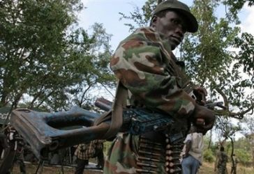 An armed fighter of the Lord's Resistance Army (LRA) stands guard in 2006 in Ri-Kwamba, southern Sudan.