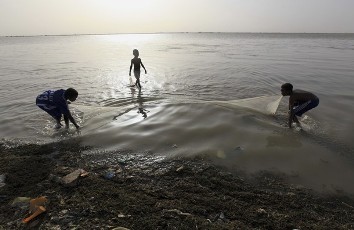 Children fish in the river Nile near the capital Khartoum May 04, 2010 (Reuters)