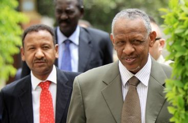 Sudanese presidential assistant Nafie Ali Nafie (R) and adviser Mustafa Osman Ismail arrive to the Arab League headquarters to meet with secretary general Amr Mussa in Cairo on May 16, 2010 (Getty)