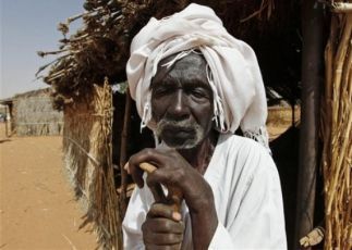 An elderly Sudanese refugee man waits his turn to vote at a polling statio, unseen, at the refugee camp of Zamzam  April 12, 10 (AP)