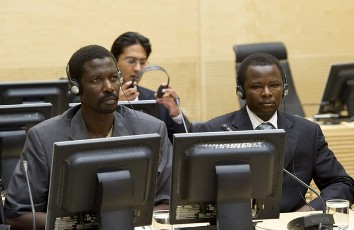 Abdallah Banda Abakaer Nourain (L) and Saleh Mohammed Jerbo Jamus, both suspected of having committed war crimes in Darfur, arrive voluntarily at the International Criminal Court in The Hague, Netherlands, June 17, 2010 (Reuters)