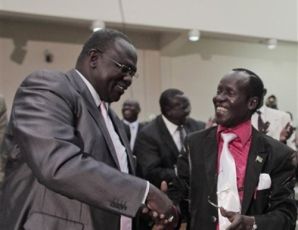 Opposition leader Riek Machar (L) with James Wani Igga after the latter was nominated national assembly speaker (AP)