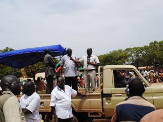 Gov Malong Awan speaks at an artists rally in Aweil as Robert Majok stands next to him (ST)