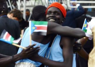 Sudanese celebrate at the peace accord signing ceremony in Kenya's capital Nairobi, Jan. 9, 2005.