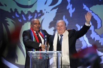 FIFA President Sepp Blatter, right, and South African President Jacob Zuma, left, acknowledge the crowd during the opening concert for the soccer World Cup at Orlando stadium in Soweto, South Africa, Thursday, June 10, 2010 (AP)