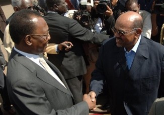 Sudanese President Omar el-Bashir, right, receives Chad President Idris Deby (AP)