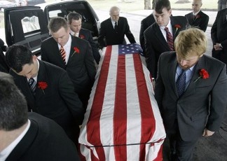 Pallbearers carry the casket of John Granville (Reuters)