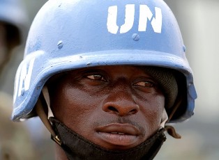 A UN soldiers guards a high-level meeting of Chinese, Russian, European, United Nations and African Union officials in El-Fasher, the capital of North Darfur on July 5, 2010 (AFP)