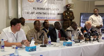 Photo handout from UNAMID showing  (from left to right) Russian special  envoy Mikhail Margelov, joint United Nations and African Union mediator Dijibril Bassole,  UNAMID Joint Special Representative Ibrahim Gambari, North Darfur State Governor, Osman Mohammed Yousif Kibir July 5, 2010 (Olivier Chassot)