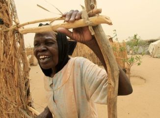 A woman stands near a makeshift tent at Sakale Wali IDPs camp in the South Darfur town of Nyala May 29, 2010. (Reuters)