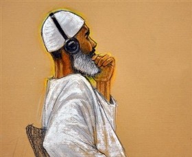 In this photo of a sketch by courtroom artist Janet Hamlin and reviewed by a U.S. Department of Defense official, 50-year-old al-Qaida cook from Sudan, Ibrahim Ahmed Mahmoud al-Qosi,, left, attends his war crimes trial at the Camp Justice compound on Guantanamo Bay U.S. Naval Base in Cuba, Wednesday, Aug. 11, 2010 (AP)