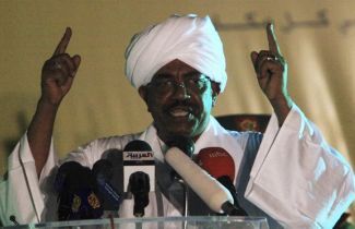 Sudan_s_President_Omar_al-Bashir_speaks_at_an_iftar_organized_by_Sudanese_Copts_at_the_Coptic_Club_in_Khartoum_during_Ramadan_August_23_reu.jpg