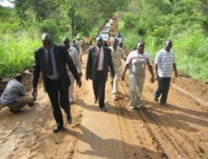 Minister Otim and USAID officials inspecting improved road, (Richard Ruati/ST)