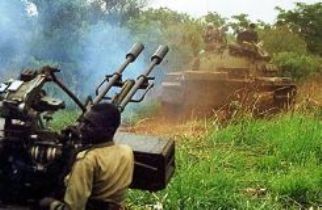 Ugandan infantry convoy hunt for LRA rebels, near Aruu junction, 40 miles from Juba, southern Sudan, in 2002. (AFP)