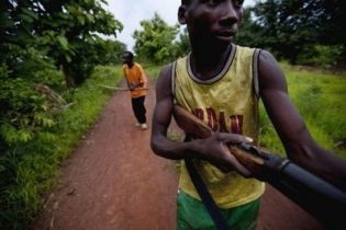 Arrow Boys seen here in May, patrol a village in south Sudan in an attempt to defend themselves from attacks LRA rebels (AFP)
