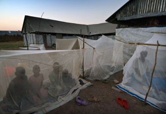 Mothers and children waking up under mosquito nets at MSF health facility, south Sudan©Sven Torfinn
