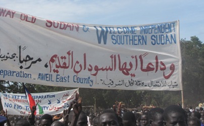 Demonstrators hold a banner saying Good bye Old Sudan, Welcome Independent Southern Sudan in Aweil on September 10 (ST)