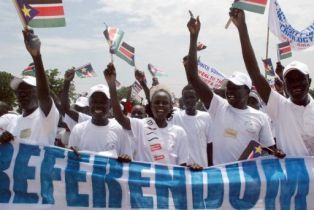 Southern Sudanese gather at the grave of their first president John Garang on July 30, 2010 in memory of those killed in a 22-year long war with the north (AFP)